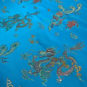 בד ברוקד כחול טורקיז דרקונים